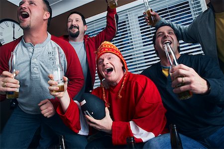 football game yelling - Men Watching Sports on TV Stock Photo - Premium Royalty-Free, Code: 600-02200112