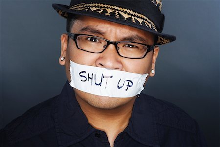 Tape With Shut Up Written on it Covering Man's Mouth Stock Photo - Premium Royalty-Free, Code: 600-02200296