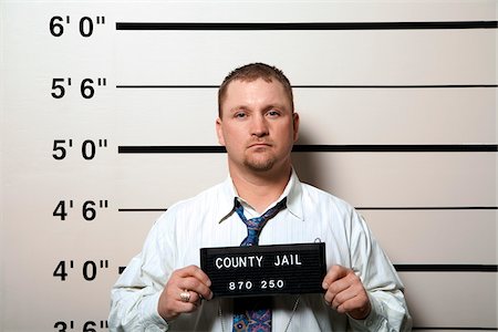 people with a jail sign - Mug Shot of Man Stock Photo - Premium Royalty-Free, Code: 600-02201436