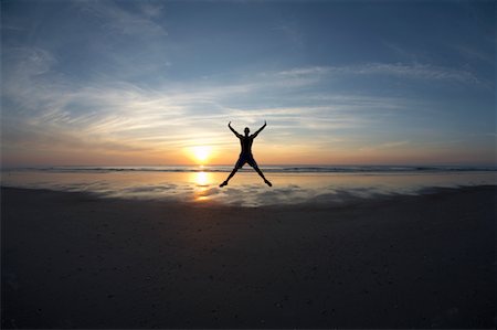 sport dawn - Man Jumping on Beach Stock Photo - Premium Royalty-Free, Code: 600-02222978