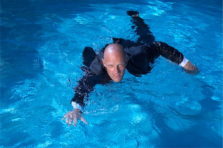 swimming in business suit - Businessman Swimming in Pool Stock Photo - Premium Royalty-Free, Code: 600-02222983