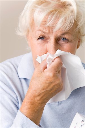 Woman Blowing Nose Stock Photo - Premium Royalty-Free, Code: 600-02244872