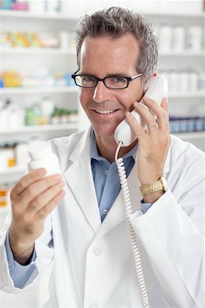 Pharmacist Talking on the Phone Stock Photo - Premium Royalty-Free, Code: 600-02245611