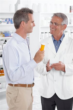 Pharmacist Talking to Client Stock Photo - Premium Royalty-Free, Code: 600-02245660