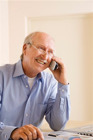 Man Ordering From Catalogue Stock Photo - Premium Royalty-Free, Code: 600-02257935