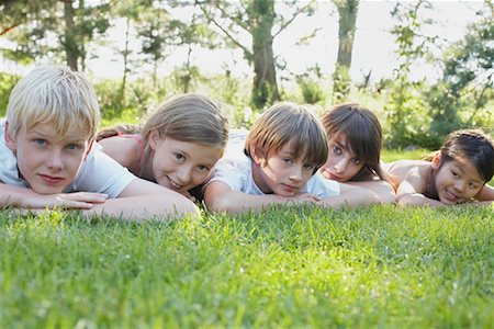 simsearch:600-01248829,k - Group Portrait of Kids Lying Down Outdoors, Elmvale, Ontario, Canada Stock Photo - Premium Royalty-Free, Code: 600-02265311