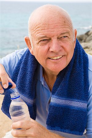 simsearch:400-05115517,k - Portrait of Man With Towel Around His Shoulders, Drinking Bottle of Water Stock Photo - Premium Royalty-Free, Code: 600-02290080