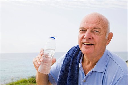 simsearch:400-05115517,k - Portrait of Man With Towel Around His Shoulders, Drinking Bottle of Water Stock Photo - Premium Royalty-Free, Code: 600-02290081
