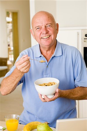 Portrait of Man Eating Cereal Stock Photo - Premium Royalty-Free, Code: 600-02290187