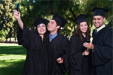 College Graduates with Cellular Phones Stock Photo - Premium Royalty-Free, Code: 600-02312361