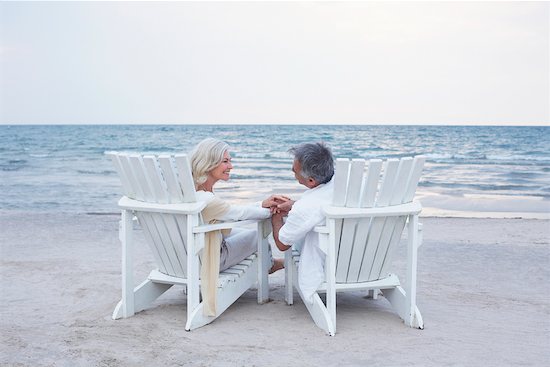 chairs on beach. Sitting in Chairs on Beach