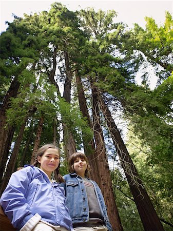 Portrait of Girl and Boy in Front of Giant Redwoods, Muir Woods National Monument, California, USA Stock Photo - Premium Royalty-Free, Code: 600-02347998