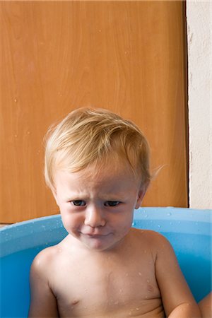 Little Boy in Plastic Tub Stock Photo - Premium Royalty-Free, Code: 600-02348922