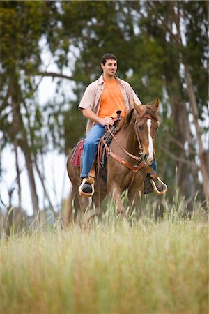 Man Horseback Riding on Ranch, Santa Cruz, California, USA Stock Photo - Premium Royalty-Free, Code: 600-02376694
