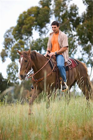 Man Horseback Riding on Ranch, Santa Cruz, California, USA Stock Photo - Premium Royalty-Free, Code: 600-02376695