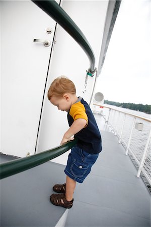 simsearch:600-02633832,k - Boy on the Deck of a Ship Stock Photo - Premium Royalty-Free, Code: 600-02376862