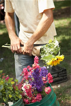 Flower Seller Wrapping Flowers at Organic Farmer's Market Stock Photo - Premium Royalty-Free, Code: 600-02377087