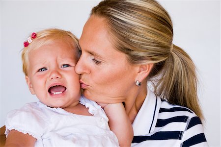Mother Comforting Baby Girl Stock Photo - Premium Royalty-Free, Code: 600-02371055