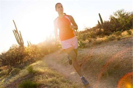 Woman Running on  Desert Trail, Saguaro National Park, Arizona, USA Stock Photo - Premium Royalty-Free, Code: 600-02385971