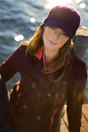 Woman Sitting On Dock by Lake Stock Photo - Premium Royalty-Free, Code: 600-02386149