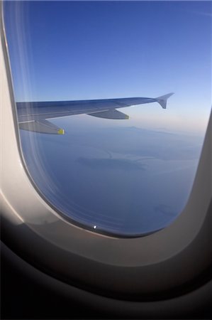 View of Wing from Airplane Window, Tuscany, Italy Stock Photo - Premium Royalty-Free, Code: 600-02428493