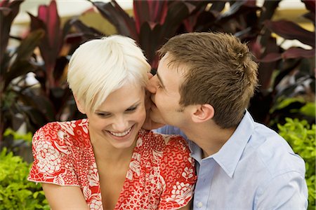 flirty couple blond smile - Young Couple Being Romantic Outdoors Stock Photo - Premium Royalty-Free, Code: 600-02429158