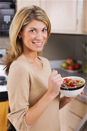 Portrait of Woman Eating Salad Stock Photo - Premium Royalty-Free, Code: 600-02447825
