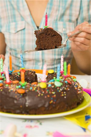 simsearch:600-02461257,k - Woman Eating Birthday Cake Stock Photo - Premium Royalty-Free, Code: 600-02461248