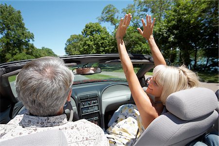 Excited Couple in Convertible, Niagara Falls, Ontario, Canada Stock Photo - Premium Royalty-Free, Code: 600-02593728