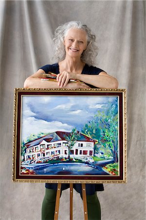 Portrait of Woman Posing with Painting Stock Photo - Premium Royalty-Free, Code: 600-02593818