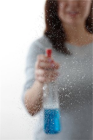 Woman Cleaning Glass Stock Photo - Premium Royalty-Free, Code: 600-02593993