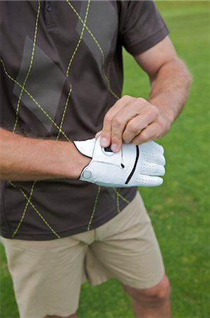 simsearch:600-01124353,k - Man Putting on Golf Glove, Burlington, Ontario, Canada Stock Photo - Premium Royalty-Free, Code: 600-02637650