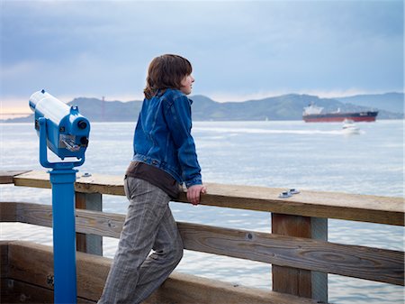 Boy Looking over Water from Pier, San Francisco, California, USA Stock Photo - Premium Royalty-Free, Code: 600-02637685