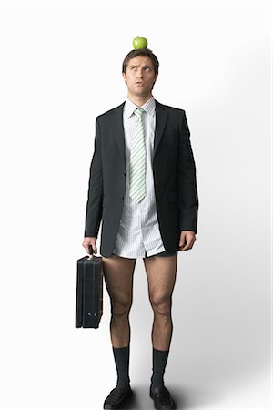 Businessman with Apple on Head and No Pants Stock Photo - Premium Royalty-Free, Code: 600-02659993