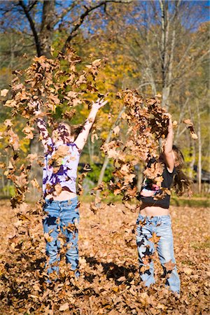 Girls Playing in Fall Leaves, Grafton, Vermont, USA Stock Photo - Premium Royalty-Free, Code: 600-02660017
