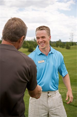 Men Shaking Hands on the Golf Course, Burlington, Ontario, Canada Stock Photo - Premium Royalty-Free, Code: 600-02670277