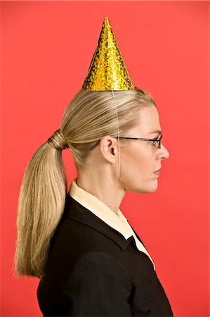 simsearch:600-03638622,k - Businesswoman Wearing Party Hat Stock Photo - Premium Royalty-Free, Code: 600-02694647