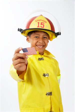 simsearch:700-02046160,k - Boy Dressed as Firefighter Foto de stock - Sin royalties Premium, Código: 600-02693679