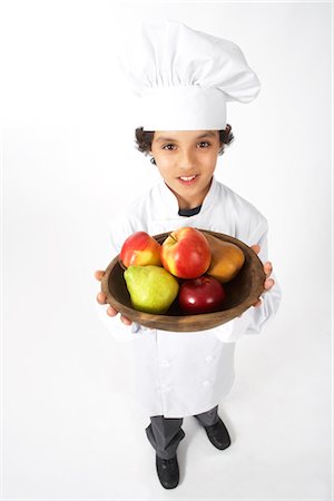 simsearch:600-02693750,k - Boy Dressed Up as a Chef Holding Bowl of Fruit Stock Photo - Premium Royalty-Free, Code: 600-02693741