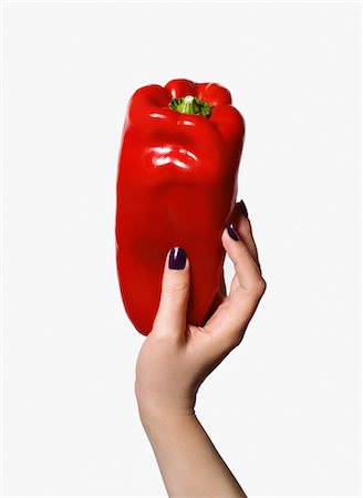 Woman's Hand Holding Red Pepper Stock Photo - Premium Royalty-Free, Code: 600-02693869