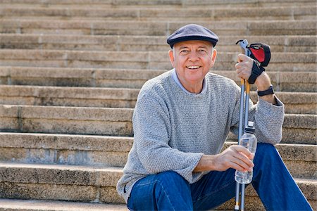 Nordic Walker Taking a Break and Drinking Bottled Water Stock Photo - Premium Royalty-Free, Code: 600-02693884