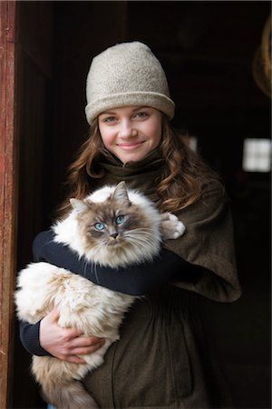 Portrait of a Teenage Girl Holding a Cat on a Farm in Hillsboro, Oregon, USA Stock Photo - Premium Royalty-Free, Code: 600-02700699
