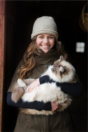 Portrait of a Teenage Girl Holding a Cat on a Farm in Hillsboro, Oregon, USA Stock Photo - Premium Royalty-Free, Code: 600-02700700