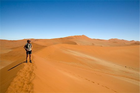 simsearch:862-03713108,k - Woman Standing on Sand Dune, Namib-Naukluft National Park, Namibia Stock Photo - Premium Royalty-Free, Code: 600-02700919