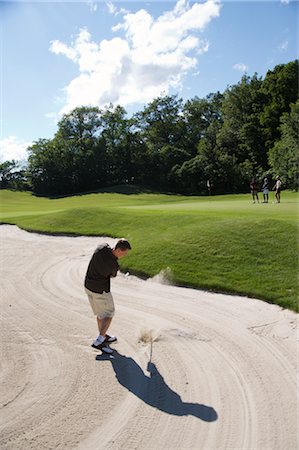 Man in Sand Trap, Burlington, Ontario, Canada Stock Photo - Premium Royalty-Free, Code: 600-02701125