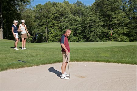 Man in Sand Trap, Burlington, Ontario, Canada Stock Photo - Premium Royalty-Free, Code: 600-02701129