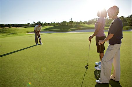 Friends Playing Golf, Burlington, Ontario, Canada Stock Photo - Premium Royalty-Free, Code: 600-02701181