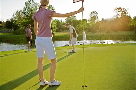 Friends Playing Golf, Burlington, Ontario, Canada Stock Photo - Premium Royalty-Free, Code: 600-02701191