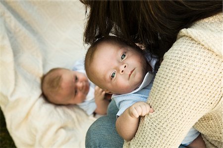 Mother Picking up Twins Stock Photo - Premium Royalty-Free, Code: 600-02701269