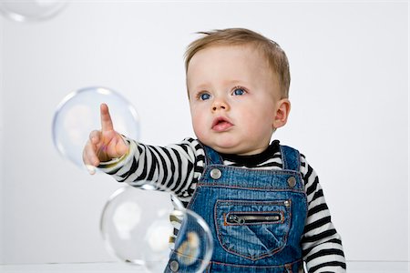 simsearch:600-02348921,k - Baby Boy Poking Bubbles Stock Photo - Premium Royalty-Free, Code: 600-02702751